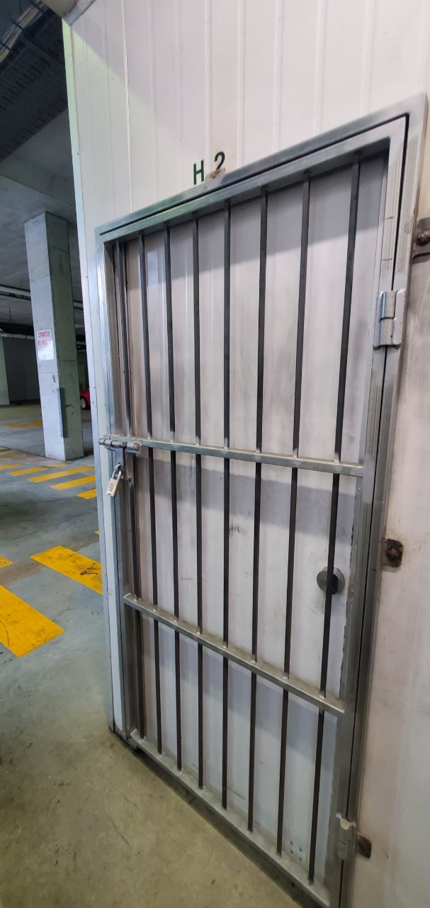 Steel security gate at car park plant room